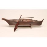 A HARDWOOD SCALE MODEL OF A FISHING BOAT, Southsea Islands, 19th century, unsigned, on stand, 23 1/