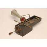 A PETER PAN GRAMOPHONE with folding record platform and collapsing alloy horn, 6 1/2" x 5" x 4 1/