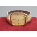 A GENTLEMAN'S 9CT GOLD "UNO" WRISTWATCH, the rounded square matt gilt dial with applied batons,
