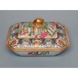 A CANTONESE PORCELAIN OBLONG VEGETABLE TUREEN AND COVER with re-entrant corners, the interior and