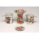 A COLLECTION OF WEMYSS POTTERY, early 20th century, all painted with pink roses, comprising tyg