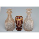 A PAIR OF GEORGIAN ANGLO-IRISH TYPE GLASS DECANTERS with mushroom stoppers, slice cut necks and