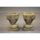 A PAIR OF COMPOSITION STONE JARDINIERES, of circular tapering form, 12 1/2" x 10",