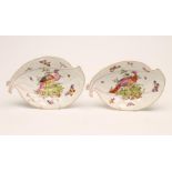 A PAIR OF FRENCH PORCELAIN LEAF DISHES, late 19th century, painted in polychrome enamels with exotic