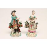 A PAIR OF DERBY PORCELAIN SMALL FIGURES, c.1765, modelled as a huntsman wearing a black hat,