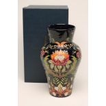 A MOORCROFT POTTERY VASE, modern, of baluster form, tubelined and painted in bright enamels with the