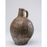 A RHENISH SALTGLAZE STONEWARE BELLARMINE/BARTMANN KRUG, late 16th century, of ovoid form, the pulled