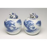 A PAIR OF HIRADO PORCELAIN JARS AND COVERS of globular form, the lift-off covers with shi-shi knops,