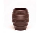 KEITH MURRAY FOR WEDGWOOD - A dark brown basalt barrel vase with five engine turned ribbed bands,