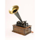 AN EDISON STANDARD PHONOGRAPH, Serial No. S160491, with oak housing and black painted horn, in oak