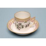 A ROYAL COPENHAGEN PORCELAIN "FLORA DANICA" CAN AND SAUCER, the can painted with "Euphrasia