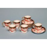 A SET OF SIX ROYAL CROWN DERBY CHINA COFFEE CANS AND SAUCERS, 1912, printed and over painted in