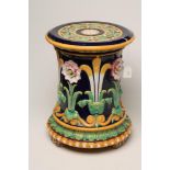 A VICTORIAN MINTONS MAJOLICA JARDINIERE STAND, 1876, of cylindrical form, moulded in relief with