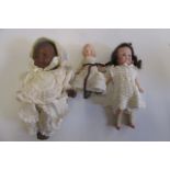 An Armand Marseille bisque head black baby doll with brown sleeping eyes, moulded hair and