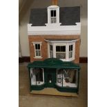 A doll's shop and house above, mid 20th century, painted wood construction, three storeys includes