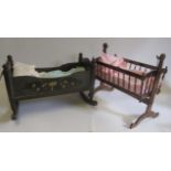 A doll's painted wood cradle, mid 20th century, with floral decoration and rockers, 22" long, and