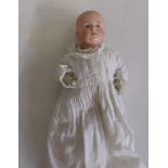 A Gebruder Heubach bisque head boy doll with intaglio eyes, moulded hair, composition bent limbed