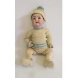 A Franz Schmidt & Co bisque head character boy doll with blue glass sleeping eyes, open mouth and