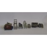 Seven miniature dolls' house items including bird cage, high chair, dominoes and piano (Est. plus