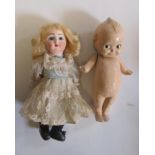 A Danel et Cie Paris-Bebe bisque head doll with fixed blue glass eyes, closed mouth, pierced ears,