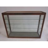 A shop display cabinet for Hornby-Dublo, glazed to three sides in oak frame, 32" wide, 22" high,