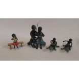 Four cold painted metal blackamoor figures comprising couple seated on trunk, two boys on crocodiles