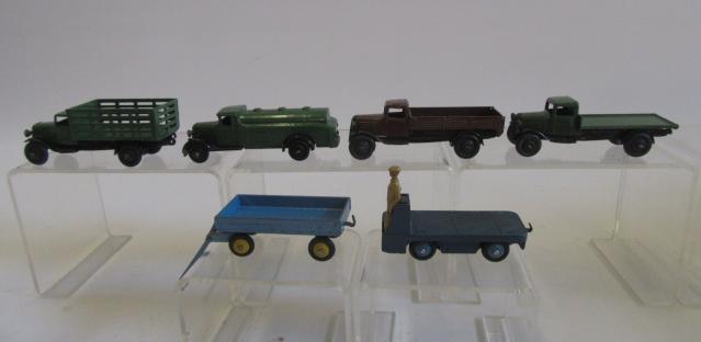 Six old Dinky Commercial models including three 25 Series lorries and a tanker, part repainted, P-