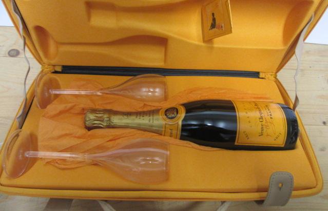 A Veuve Clicquot Traveller's Case containing one bottle NV Veuve Clicquot Ponsardin Brut Champagne