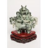 A CHINESE GREEN STAINED AND POLISHED HARDSTONE CENSER of typical form, the lift-off cover with