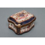 A FRENCH PORCELAIN TABLE SNUFF BOX, late 19th century, of serpentine form, enamelled in Chinese