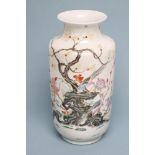 A CHINESE PORCELAIN VASE of rounded cylindrical form with waisted neck, painted in polychrome