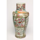 A CANTONESE PORCELAIN VASE of inverted baluster form, with fixed Dog of Fo mask ring handles,