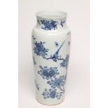 A CHINESE PORCELAIN VASE of flared cylindrical form with rounded shoulders, painted in underglaze