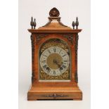 A WALNUT CASED TABLE CLOCK by Lenzkirch, the twin barrel movement with ting tang quarter striking on