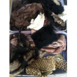 A suitcase containing vintage fur, leopard collar etc.