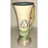 A late 1930’s Clarice Cliff tall floral handled vase, 22cms h.