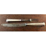 Silver handled carving knife and fork with Beverley crest of a beaver