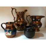 Four various jugs to include 3 copper lustre and one 18thC Jackfield, slight chip to rim - tallest