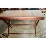 An unusual folding mahogany leather topped desk.