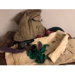 A quantity of boy scouting items to include badges, shirts, ruck sack, knives etc.