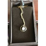 A 9 ct and cultured pearl pendant on a 9ct chain.
