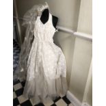 Wedding dress from 1950's, good condition including hooped petticoat, lace bodice, and full length