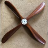 Hardwood propeller with battery drive clock to centre.