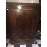 Oak corner cupboard circa 1800. 94cms h x 46cms d.