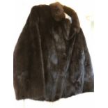 A good quality short mink jacket to fit approx UK size 12-14.
