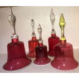 Five 19thC cranberry glass bells. 33cms tallest.