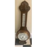 Oak aneroid barometer, 73cms h.