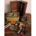 A miscellaneous lot to include microscope, Swan pen in box, British Naval Twelve Pounder cigarette