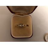 An 18 carat gold ring set with 5 diamonds, size J