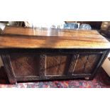 An 18thC oak coffer with repairs, 140cms w, 53cms d x 57cms h.